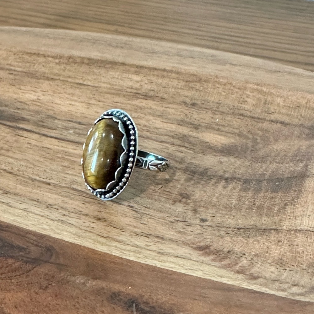 Oval Tiger Eye gem set in silver sz 6